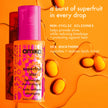 Amika Superfruit Star lightweight hair styling oil bottle with pink cap