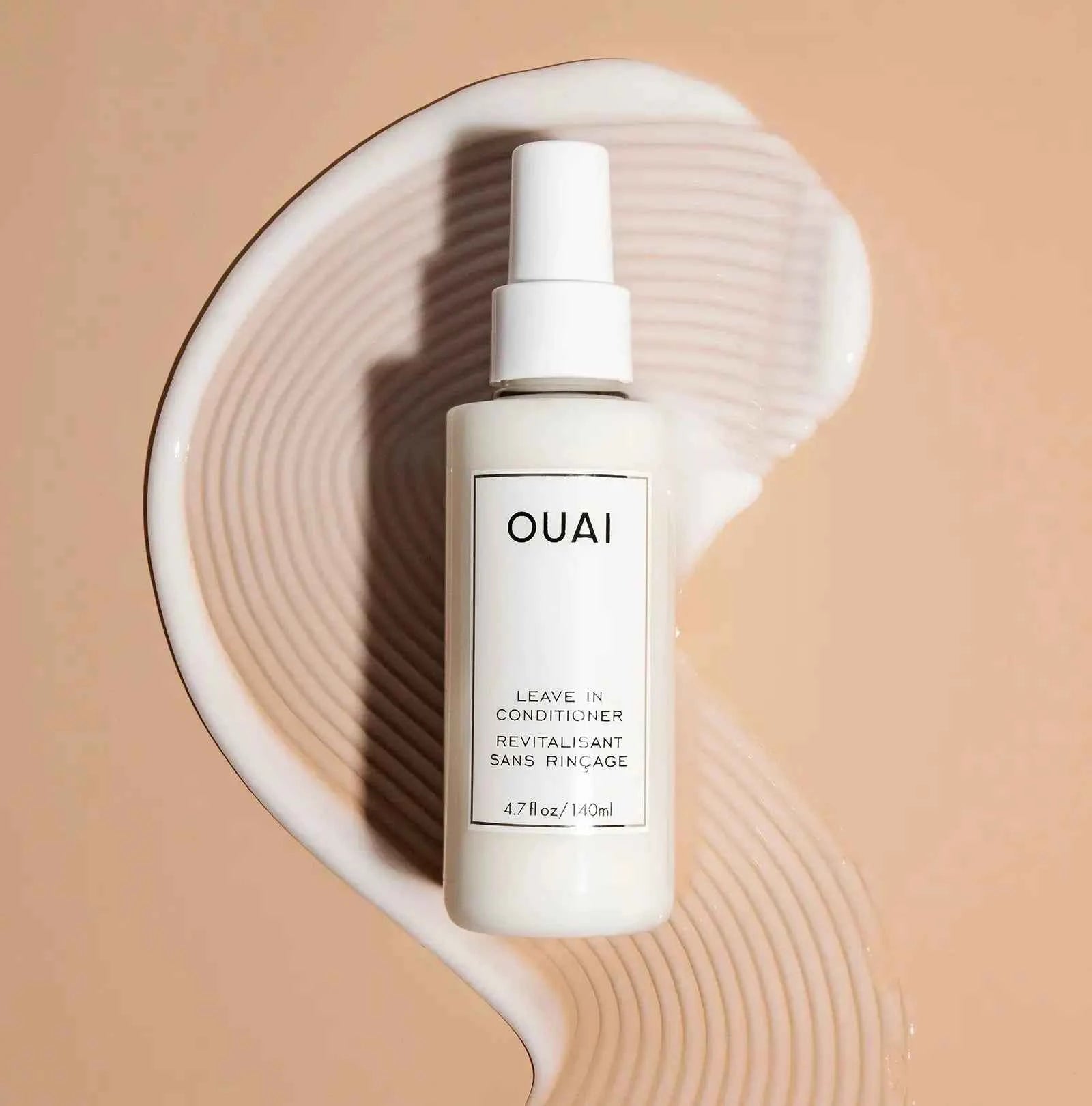 OUAI leave-in conditioner bottle with white pump, 4.7 fl oz (140 ml)