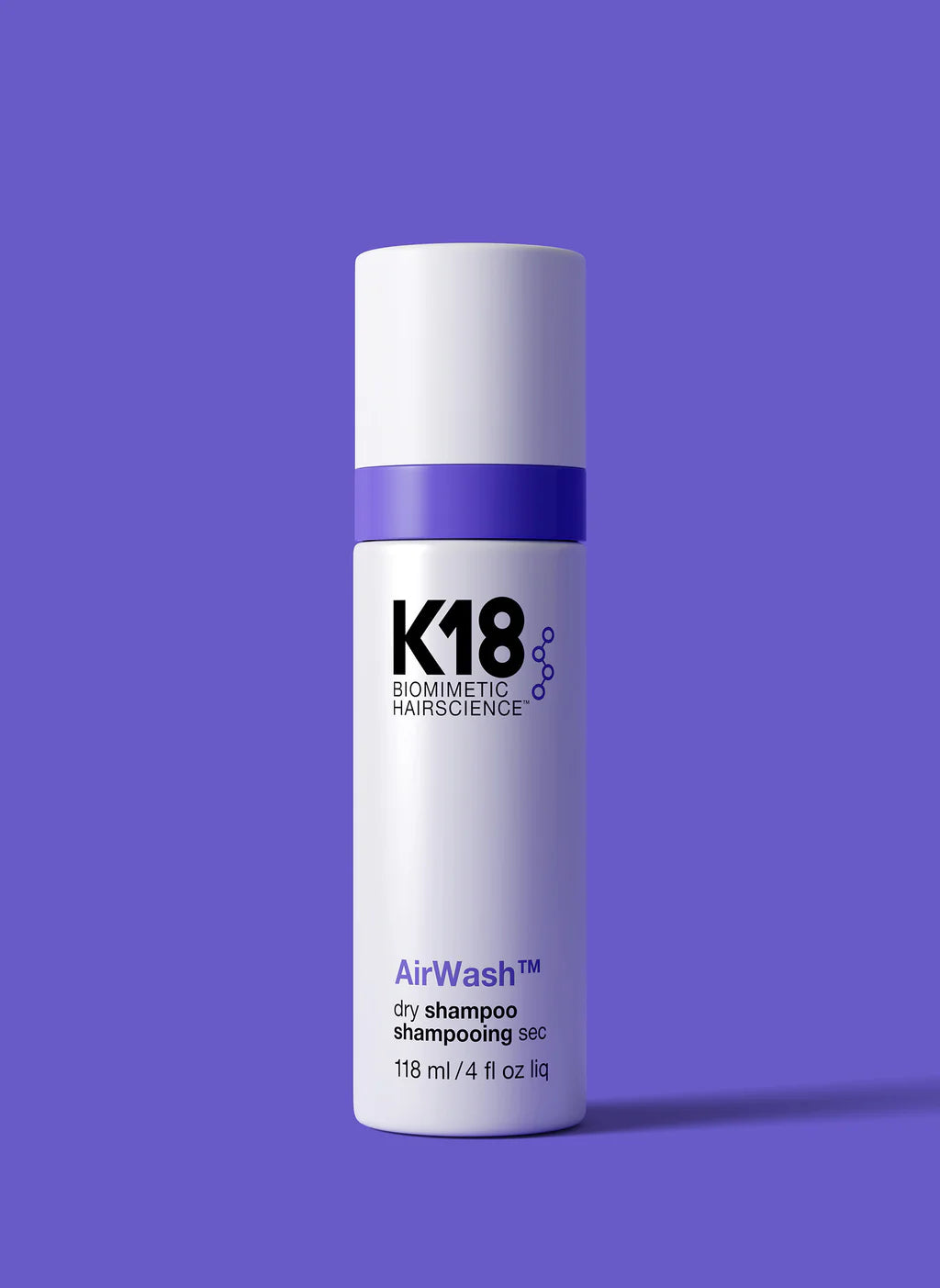 K18 AirWash dry shampoo bottle with purple cap and white label, 118 ml
