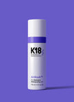 K18 AirWash dry shampoo bottle with purple cap and white label, 118 ml
