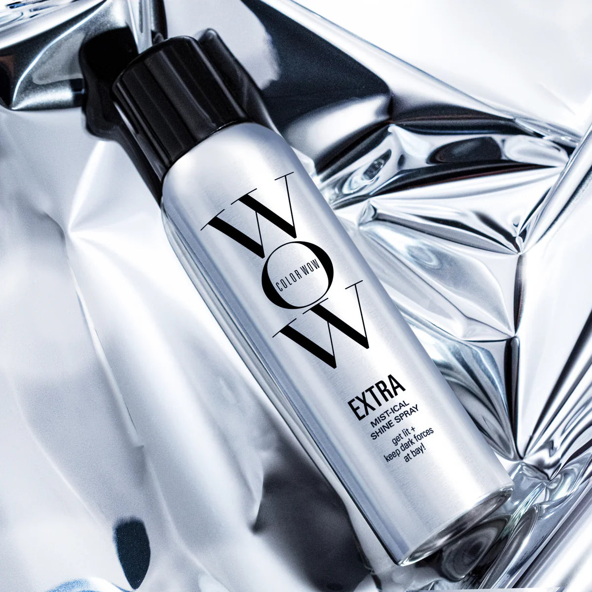 Extra Mist-ical Shine Spray bottle, silver finish with Color Wow logo, angled view