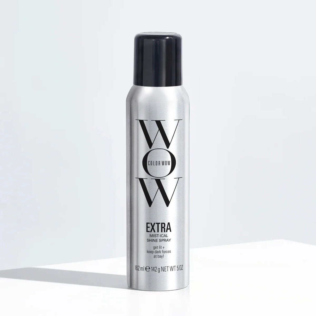 Color Wow Extra Mist-ical Shine Spray bottle with black cap on silver canister