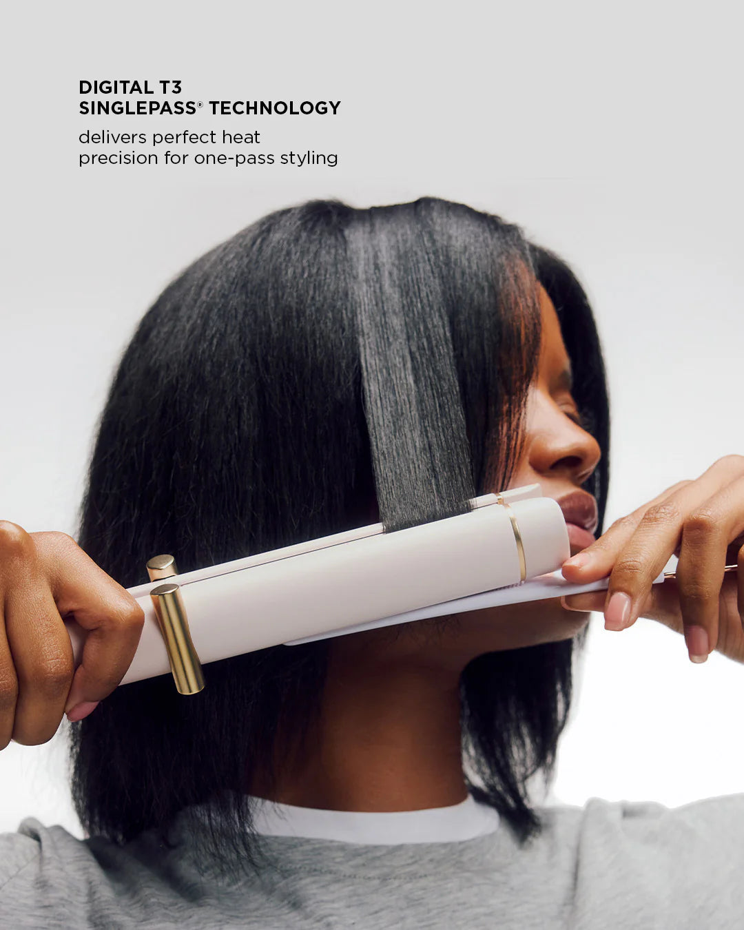Satin Blush curling straightener pressed to hair for smoothing near roots