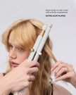 White T3 curling straightener styling blonde hair near the roots, close-up