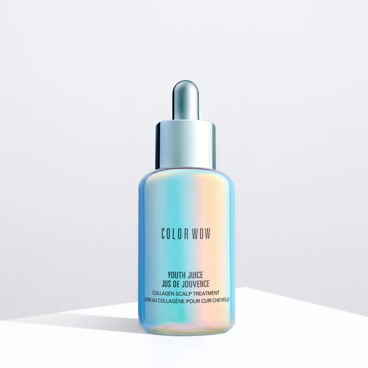 Youth Juice scalp treatment bottle with dropper, blue-tinted liquid