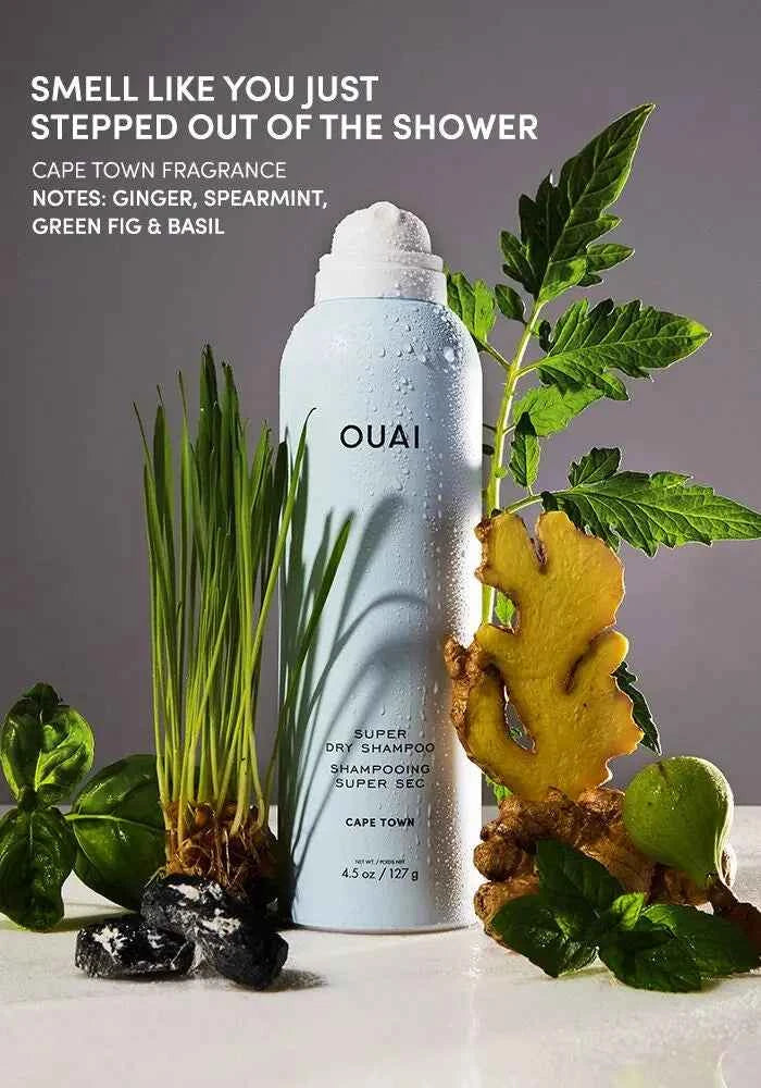 White dry shampoo bottle with OUAI logo and cap, with green plants