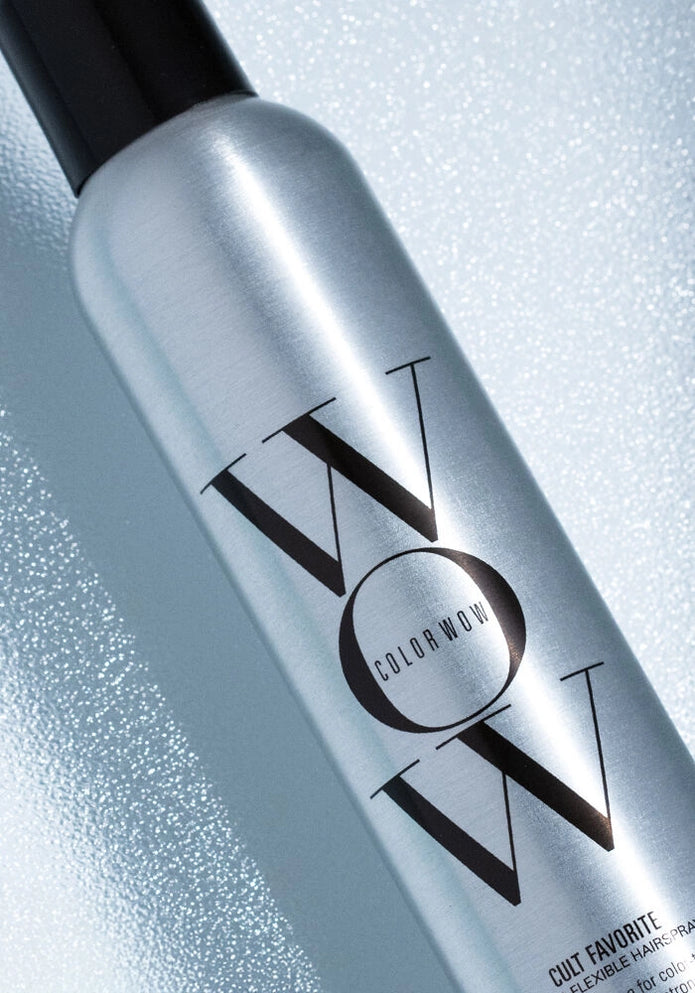 Close-up of hairspray bottle label on silver canister with black cap