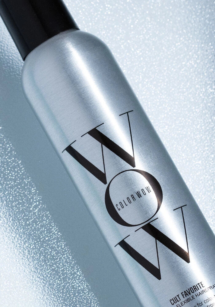 Close-up of silver Extra Mist-ical Shine Spray bottle with black cap and Color Wow logo