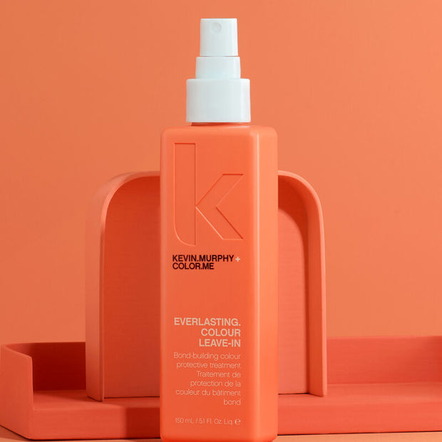 Coral-orange leave-in color treatment bottle, front label and spray pump