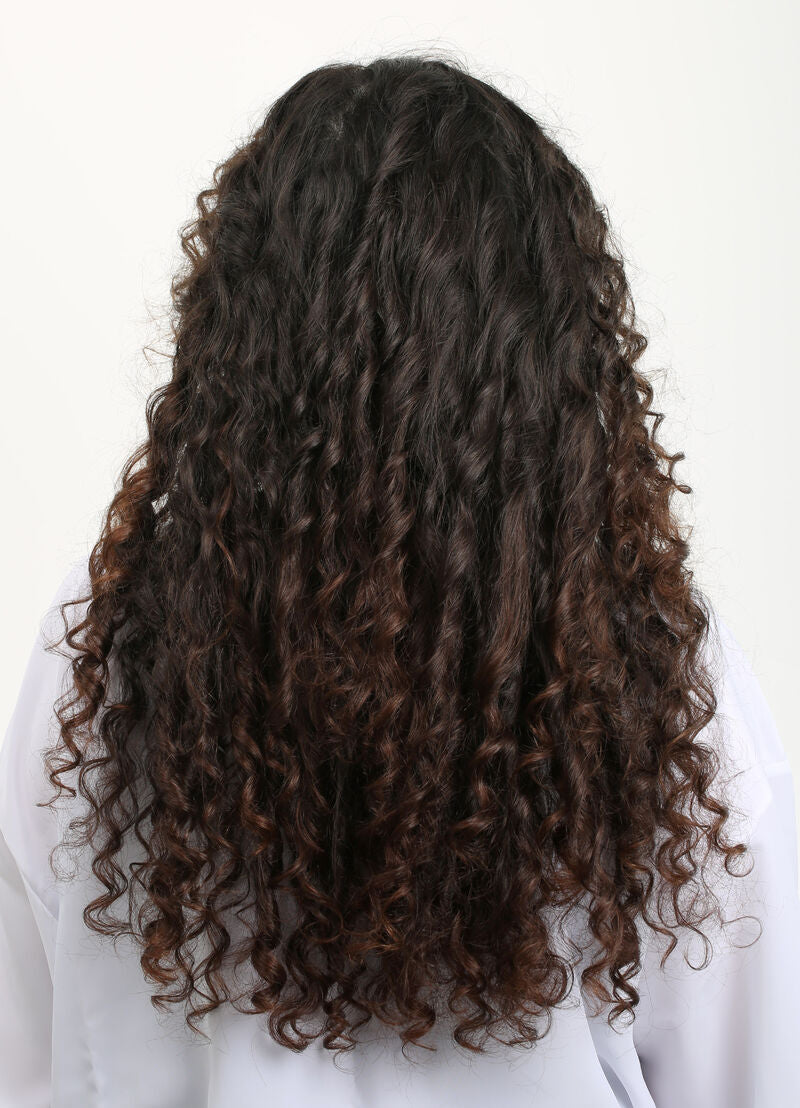 Curly dark hair, back view over white top