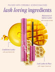 Pink tubing mascara with black brush beside yellow honeycomb; lash-conditioning ingredients