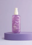 Purple Shimmer.Me Blonde bottle with white mist pump, shown on purple base