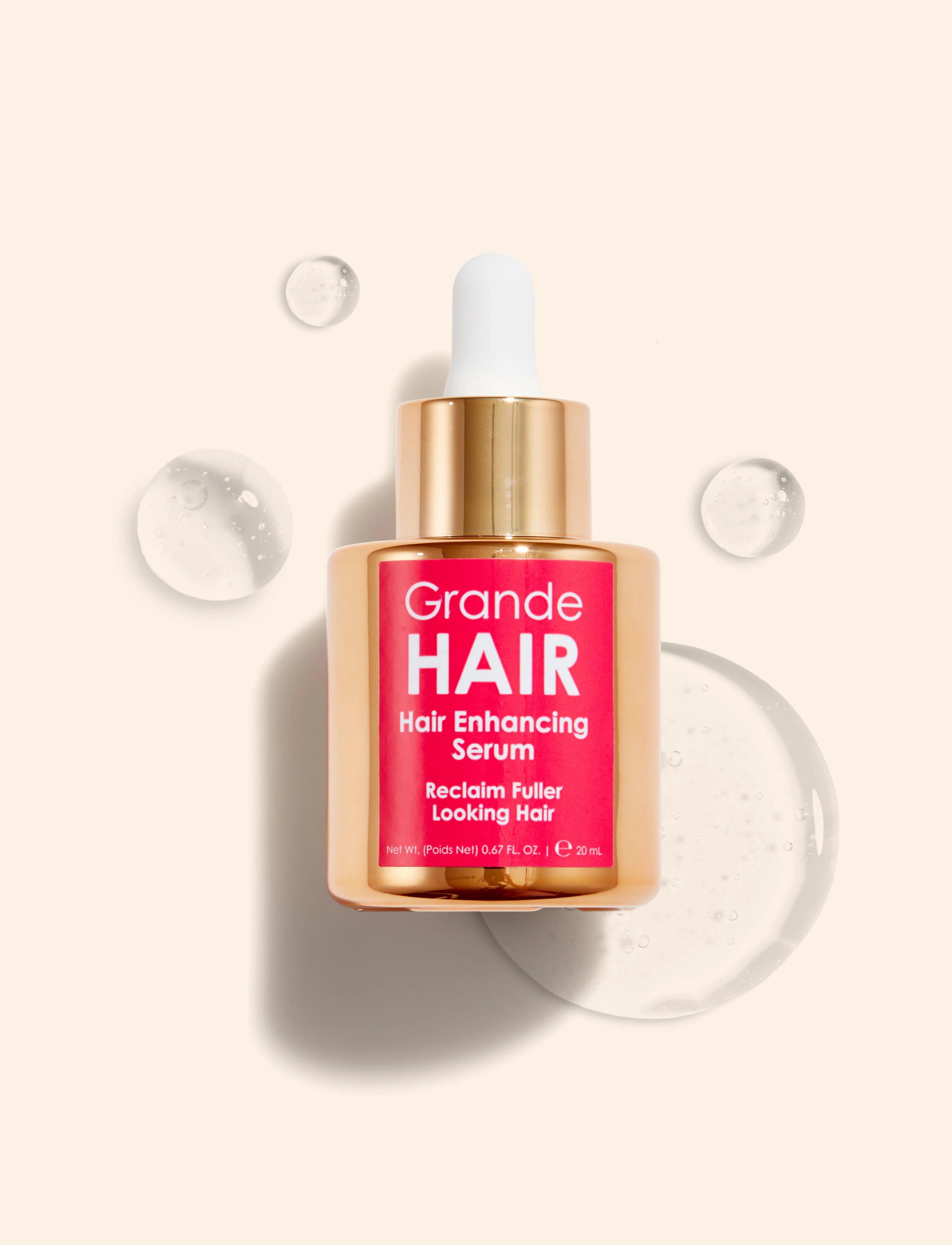 Hair Enhancing Serum bottle with gold cap, Grande HAIR label facing camera