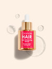 Hair Enhancing Serum bottle with gold cap, Grande HAIR label facing camera