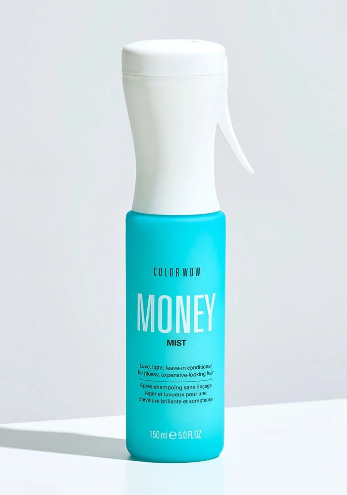 Money Mist leave-in conditioner spray bottle, teal liquid, white cap and nozzle