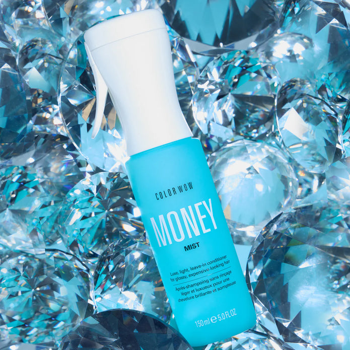 Money Mist leave-in conditioner bottle angled, teal label, white spray nozzle