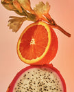 Dragon fruit and grapefruit halves with seeds, fresh fruit imagery for scalp scrub