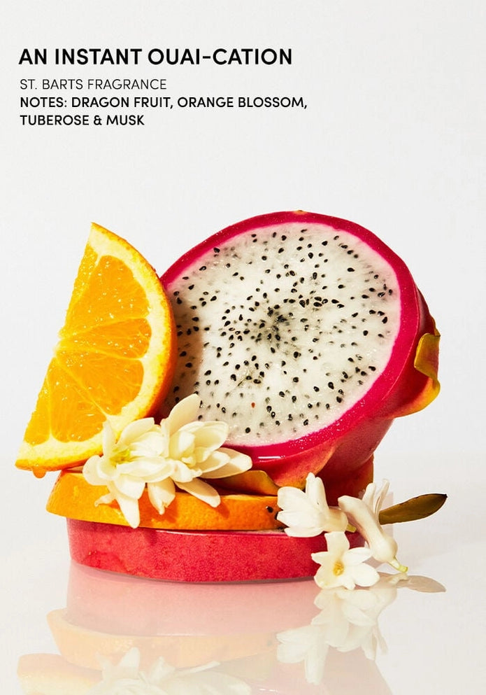 An instant OUAI-cation text with dragon fruit half, orange slice, and scrub ingredients