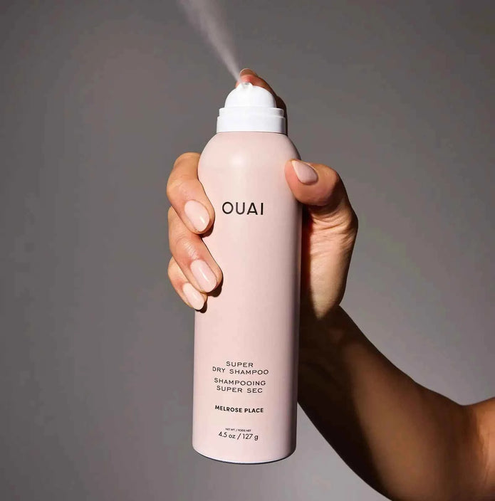 Ouai Super Dry Shampoo bottle, pale pink with white cap and nozzle
