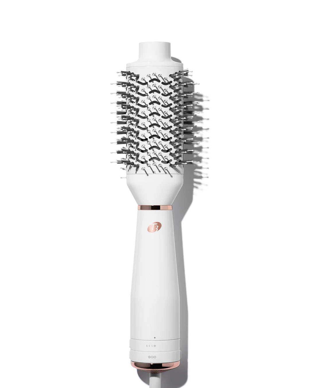 White heated brush styler with dense black bristles on a white handle base