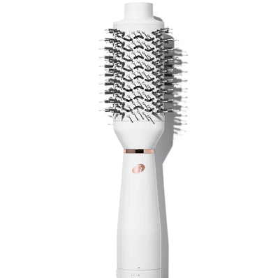 White heated brush styler with dense black bristles on a white handle base