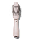 Satin blush heated brush styler with dense black bristles on a pink handle base