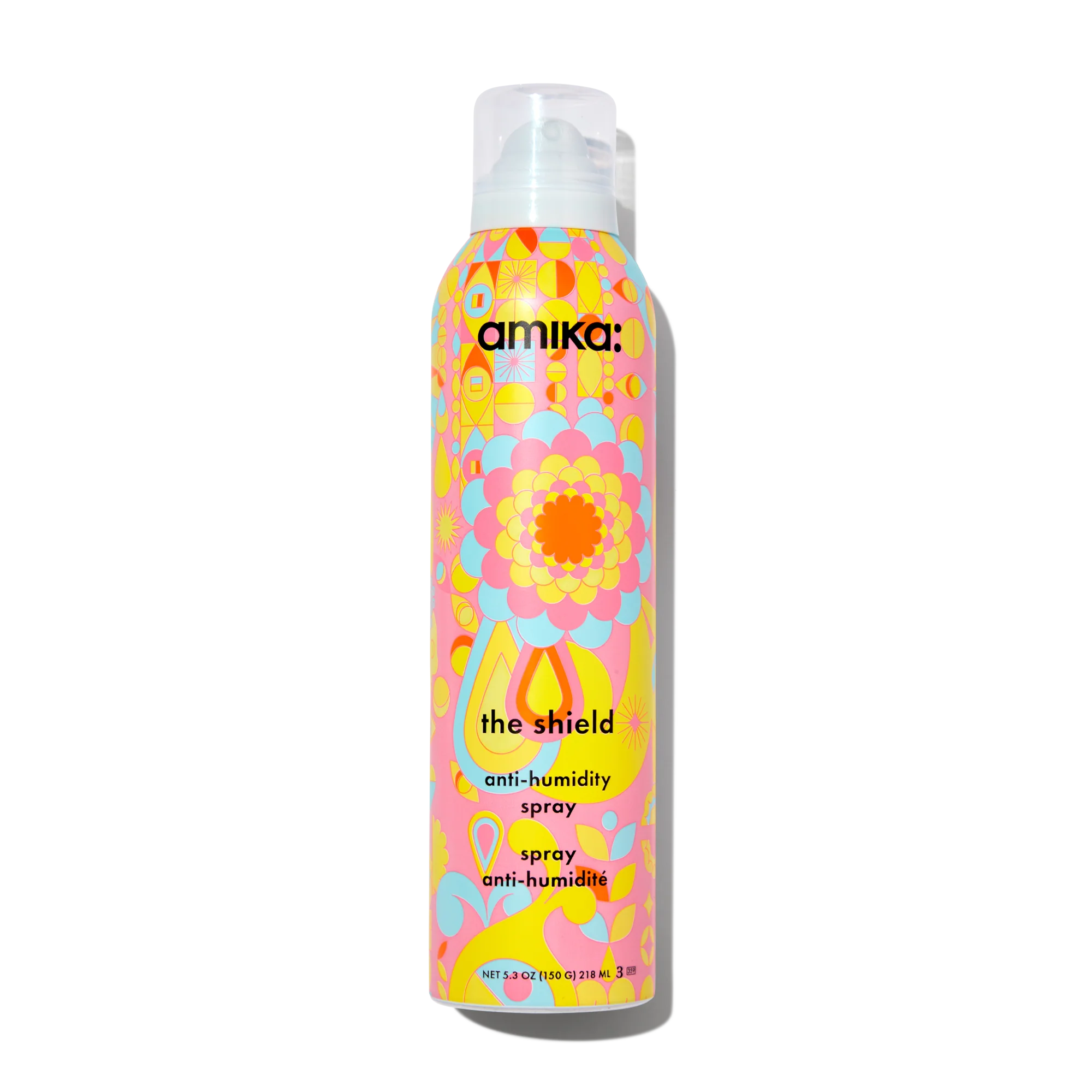 The Shield anti-humidity spray bottle with pastel floral pattern and white pump cap