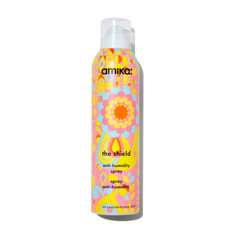 The Shield anti-humidity spray bottle with pastel floral pattern and white pump cap