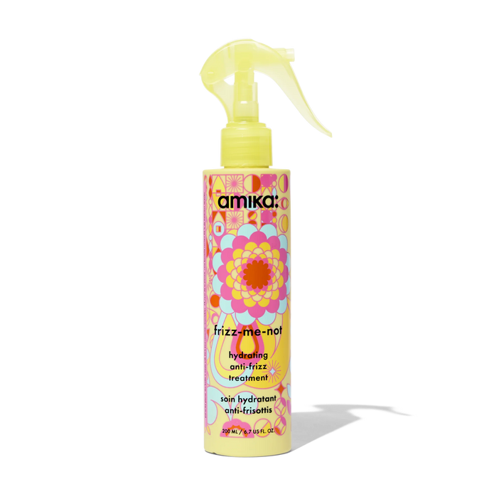 Yellow anti-frizz hair treatment bottle with pump sprayer, colorful label
