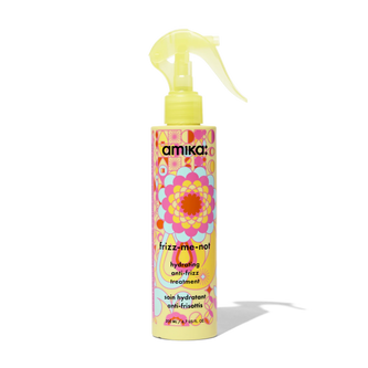 Yellow anti-frizz hair treatment bottle with pump sprayer, colorful label