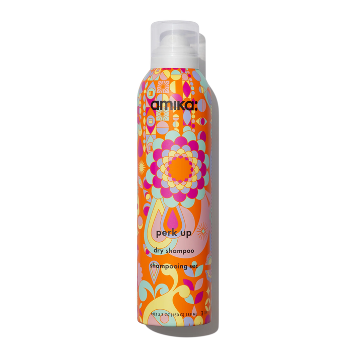 Dry shampoo canister with colorful floral pattern and white spray cap