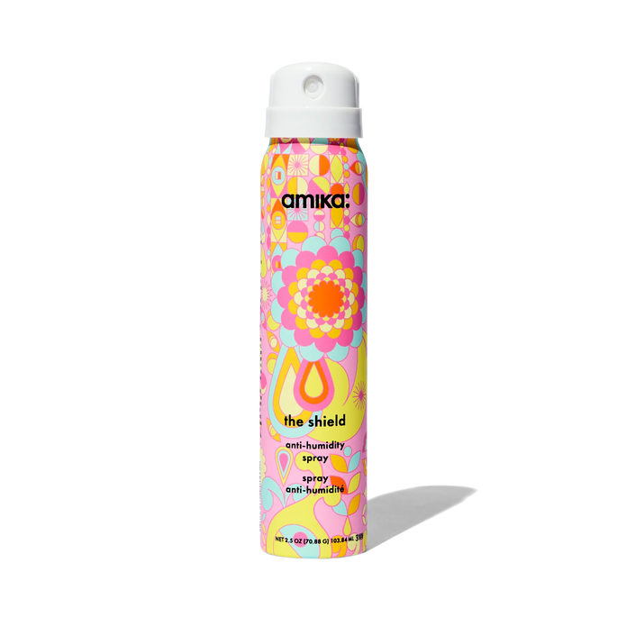 The Shield anti-humidity spray bottle in colorful floral print, angled view